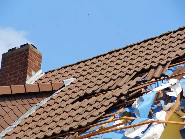Roof with shingles torn away after a storm